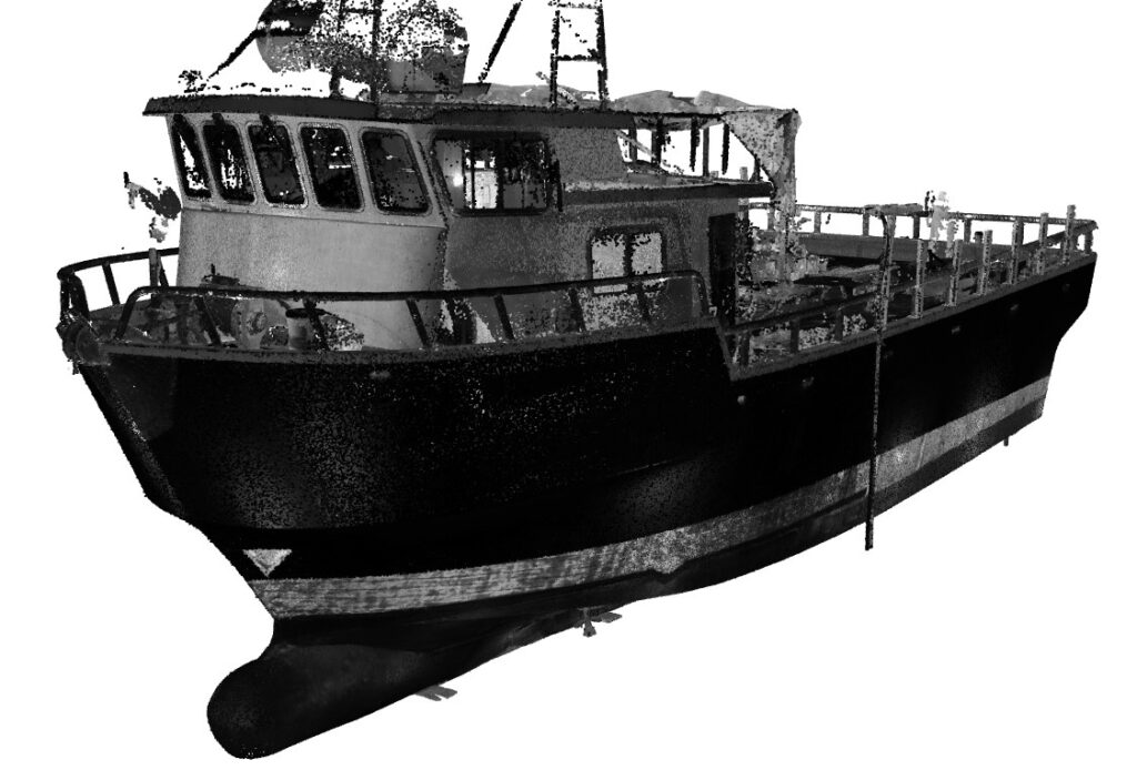 Black and white image of fishing boat in dry dock for maintenance